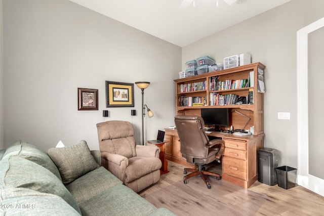 office space featuring lofted ceiling and light wood finished floors