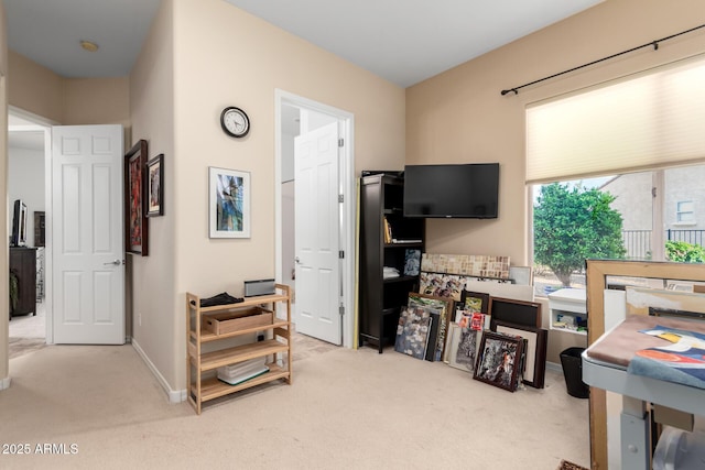 carpeted bedroom featuring baseboards