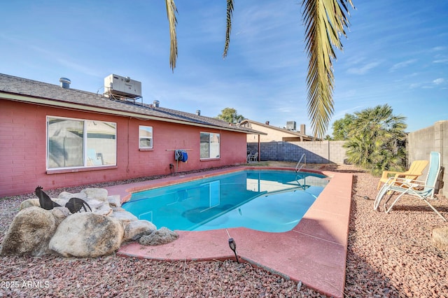 view of swimming pool featuring central AC