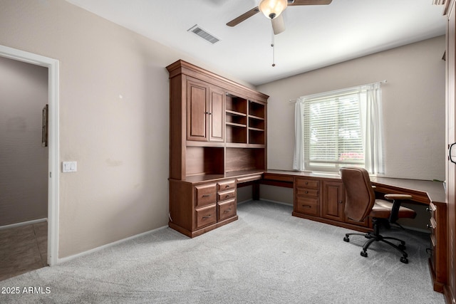 office space with ceiling fan and light colored carpet