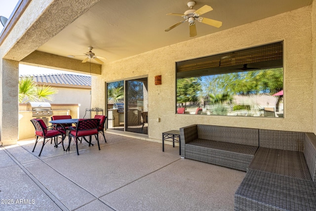 view of patio with grilling area and ceiling fan