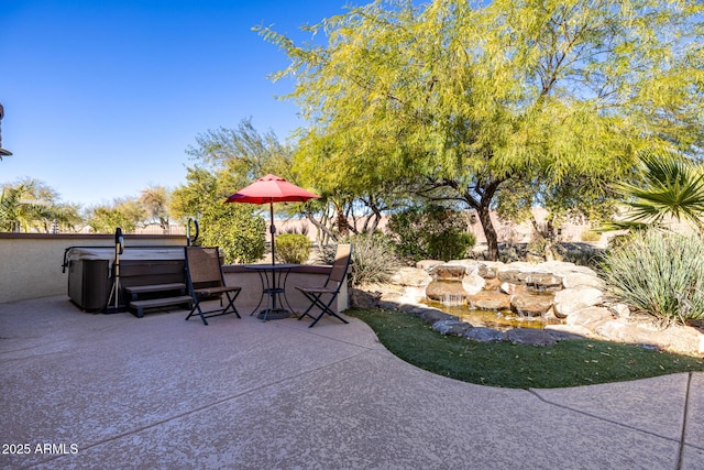 view of patio / terrace featuring a hot tub