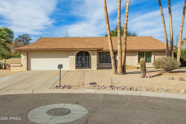 single story home featuring a garage