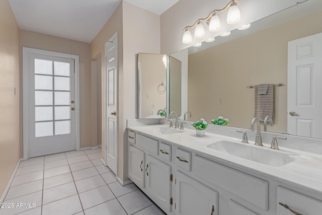 bathroom featuring tile patterned flooring and vanity