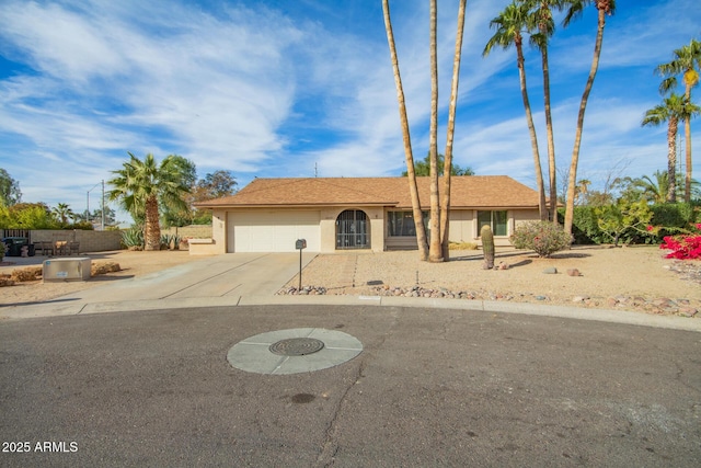 ranch-style house featuring a garage