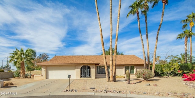 single story home with a garage