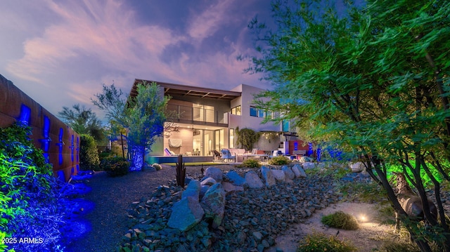 6525 E Cave Creek Rd Unit 40, Cave Creek, AZ 85331 - back of property with a patio, stucco siding, a balcony, and an outdoor living space