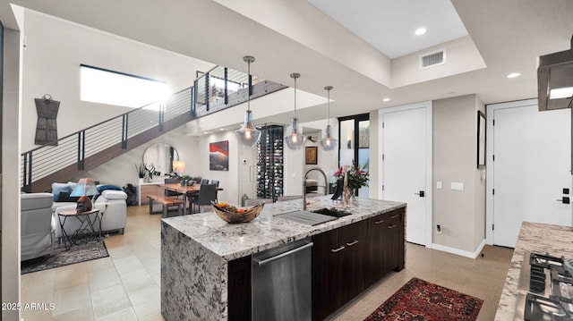 6525 E Cave Creek Rd Unit 40, Cave Creek, AZ 85331 - kitchen featuring a sink, stainless steel appliances, an island with sink, open floor plan, and light stone countertops