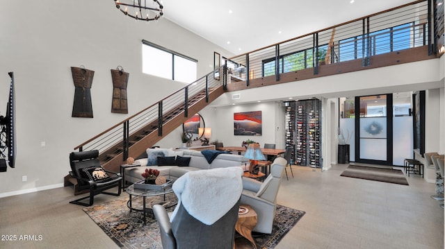 6525 E Cave Creek Rd Unit 40, Cave Creek, AZ 85331 - living area with a high ceiling, a chandelier, recessed lighting, baseboards, and stairs