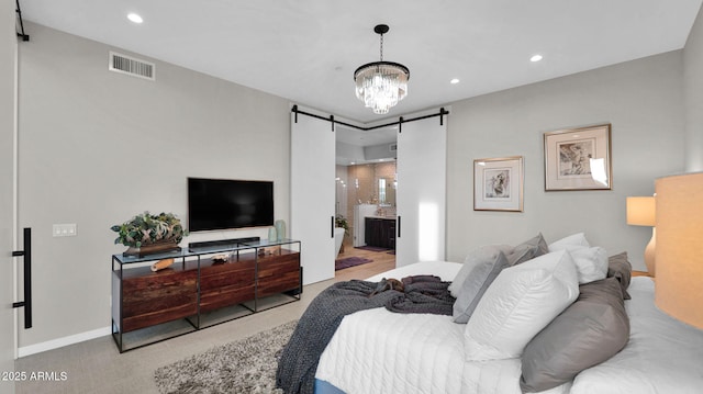 6525 E Cave Creek Rd Unit 40, Cave Creek, AZ 85331 - carpeted bedroom featuring a barn door, a chandelier, recessed lighting, connected bathroom, and baseboards