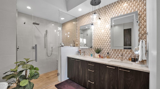 6525 E Cave Creek Rd Unit 40, Cave Creek, AZ 85331 - full bath with a stall shower, double vanity, wood finished floors, and decorative backsplash