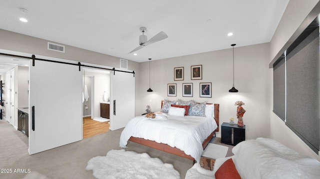 6525 E Cave Creek Rd Unit 40, Cave Creek, AZ 85331 - bedroom featuring a barn door, recessed lighting, and ceiling fan