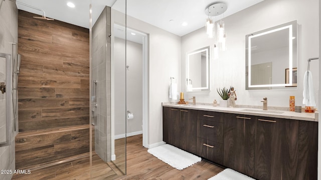 6525 E Cave Creek Rd Unit 40, Cave Creek, AZ 85331 - full bath with double vanity, wood finished floors, tiled shower, and baseboards