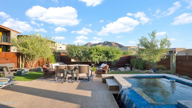 6525 E Cave Creek Rd Unit 40, Cave Creek, AZ 85331 - view of swimming pool with outdoor lounge area, a patio, a fenced backyard, and a mountain view