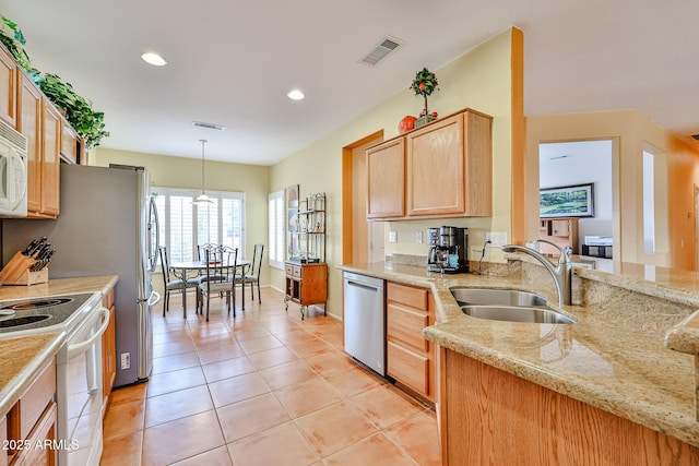 kitchen with light tile patterned flooring, sink, hanging light fixtures, light stone countertops, and white appliances