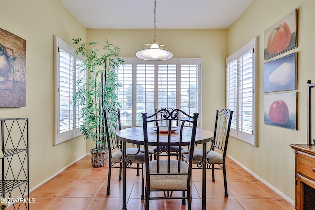 dining area with plenty of natural light and light tile patterned flooring