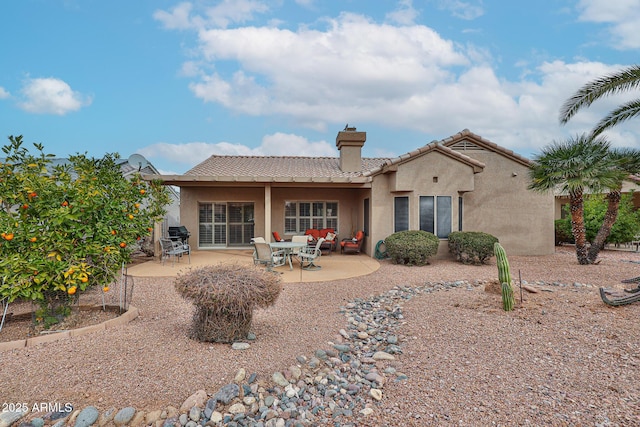 back of property featuring a patio