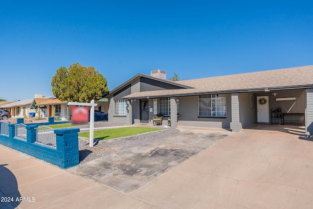 2022 W Aster Dr, Phoenix, AZ 85029 - view of front of home with a porch, fence, driveway, a shingled roof, and a chimney