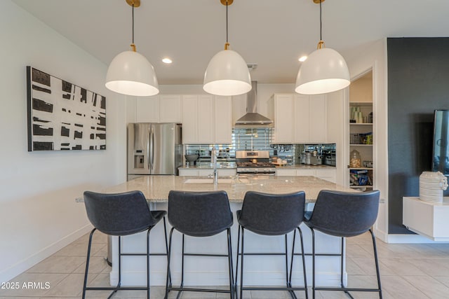 21595 S 225th Way, Queen Creek, AZ 85142 - kitchen featuring baseboards, white cabinets, stainless steel appliances, wall chimney exhaust hood, and an island with sink