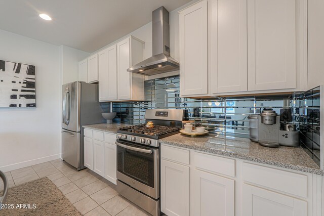 21595 S 225th Way, Queen Creek, AZ 85142 - kitchen with light tile patterned flooring, wall chimney exhaust hood, white cabinetry, tasteful backsplash, and appliances with stainless steel finishes