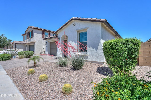 21595 S 225th Way, Queen Creek, AZ 85142 - mediterranean / spanish-style home with a garage, stucco siding, concrete driveway, and a tile roof
