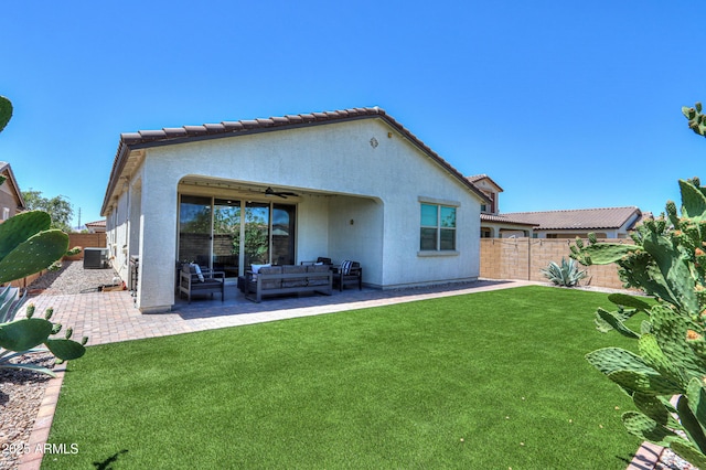 21595 S 225th Way, Queen Creek, AZ 85142 - back of house featuring central air condition unit, a fenced backyard, an outdoor living space, a lawn, and a ceiling fan
