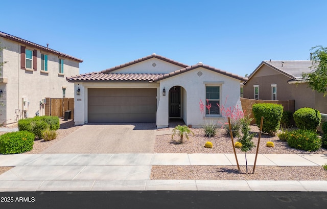 21595 S 225th Way, Queen Creek, AZ 85142 - mediterranean / spanish-style home with an attached garage, driveway, a tile roof, and stucco siding