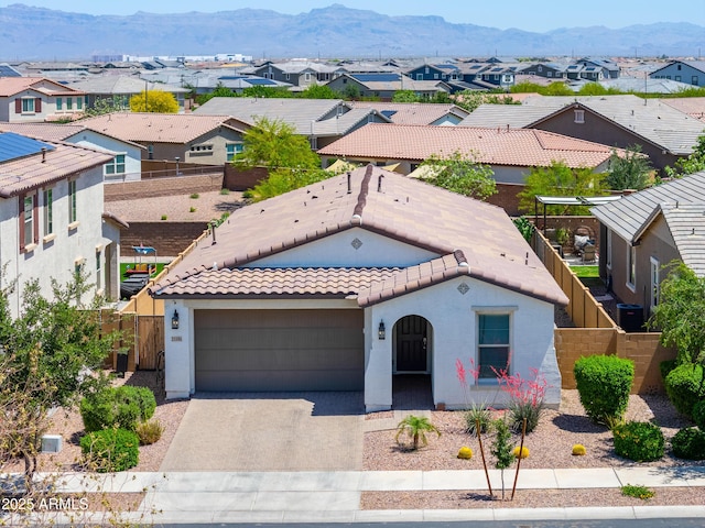 21595 S 225th Way, Queen Creek, AZ 85142 - mediterranean / spanish house with a tiled roof, driveway, a residential view, and stucco siding