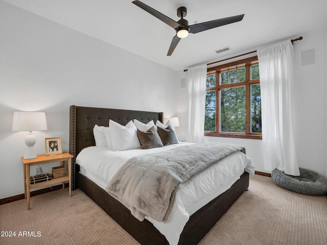 bedroom featuring carpet floors, visible vents, ceiling fan, and baseboards