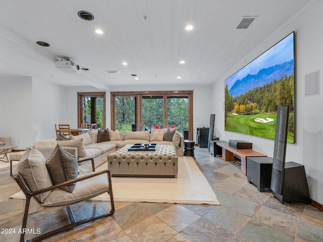 living room featuring a healthy amount of sunlight, wooden ceiling, recessed lighting, and stone tile floors