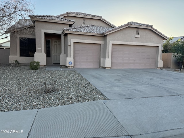 view of front of property featuring a garage