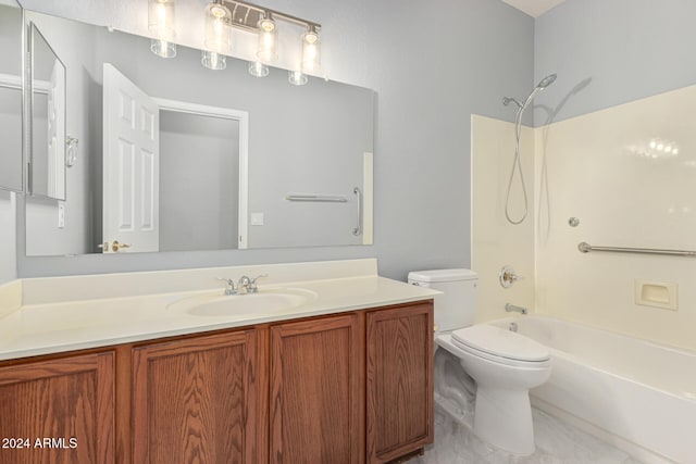 full bathroom with toilet, vanity, and washtub / shower combination