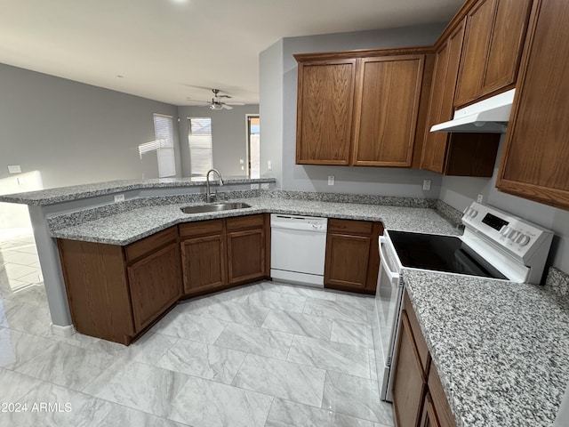 kitchen with dishwasher, sink, kitchen peninsula, ceiling fan, and range