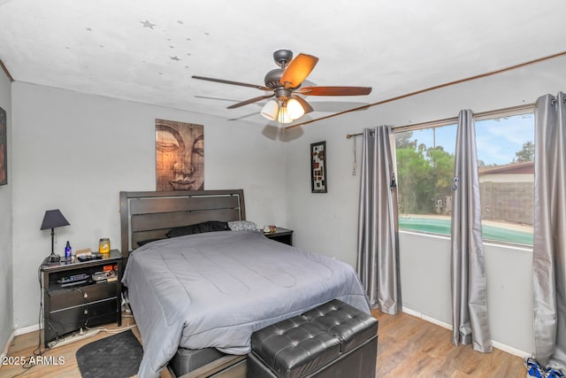 4417 W Sandra Cir, Glendale, AZ 85308 - bedroom with light wood-style floors, baseboards, and a ceiling fan