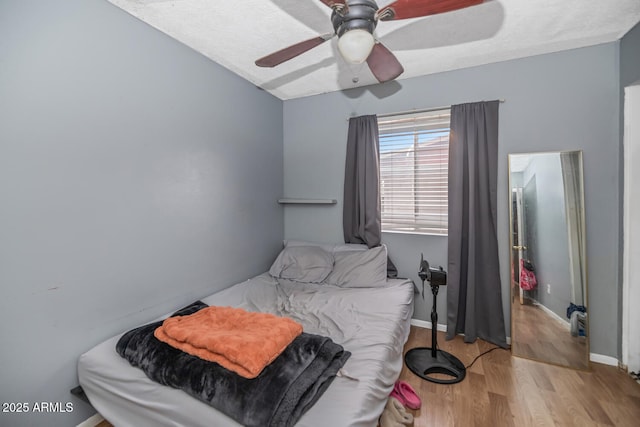 4417 W Sandra Cir, Glendale, AZ 85308 - bedroom with ceiling fan, baseboards, and wood finished floors