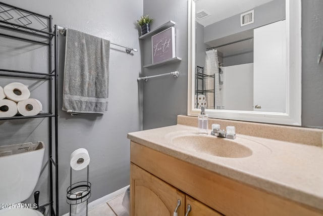 4417 W Sandra Cir, Glendale, AZ 85308 - bathroom featuring tile patterned floors, vanity, visible vents, and toilet