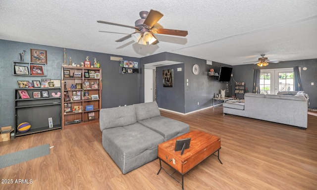 4417 W Sandra Cir, Glendale, AZ 85308 - living area with a textured ceiling, wood finished floors, ceiling fan, and baseboards