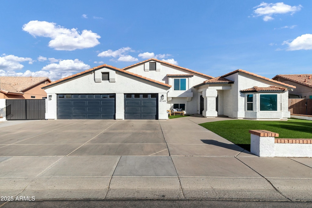 mediterranean / spanish-style home featuring a front lawn