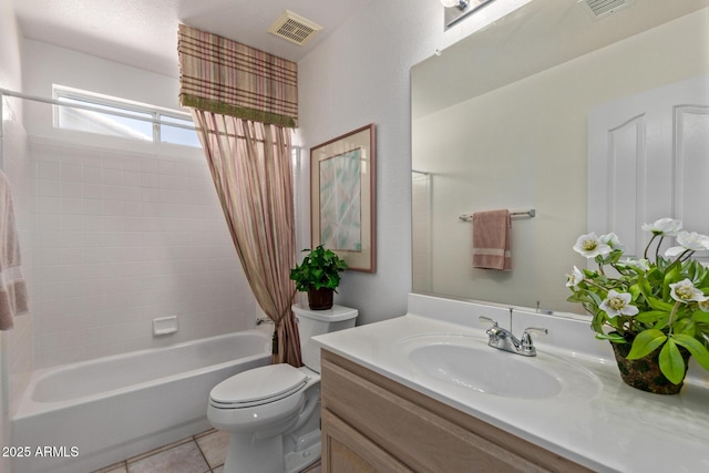 bathroom featuring toilet, vanity, shower / tub combo, and tile patterned floors