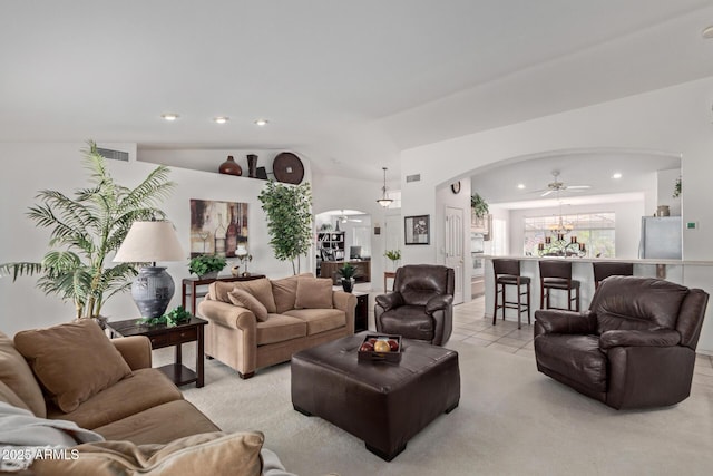 living room with arched walkways, recessed lighting, a chandelier, lofted ceiling, and light tile patterned flooring