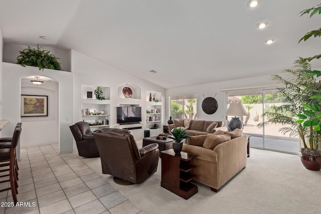 living room featuring vaulted ceiling, built in shelves, recessed lighting, and light carpet
