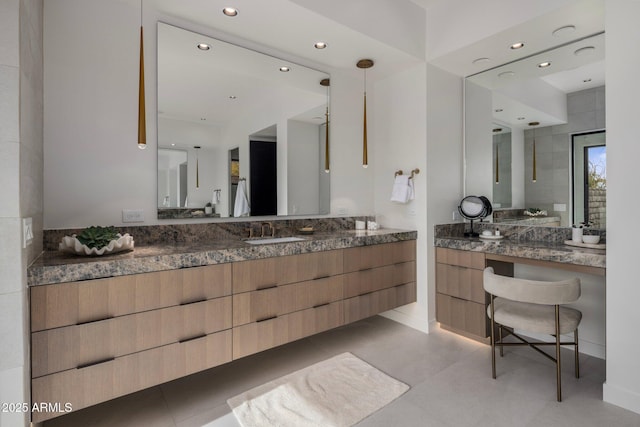 bathroom featuring tile patterned flooring and vanity