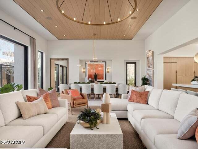 living room featuring plenty of natural light and wood ceiling