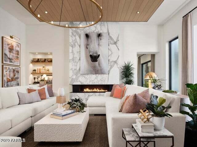 living room with a fireplace and wooden ceiling