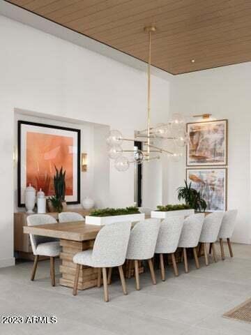 dining space featuring wooden ceiling