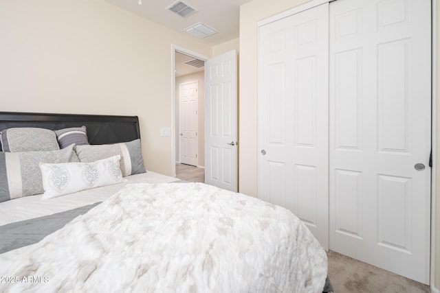 carpeted bedroom featuring a closet