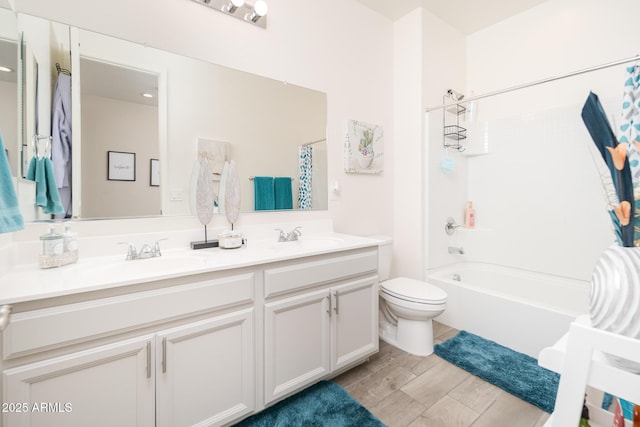 full bathroom featuring shower / bath combo with shower curtain, vanity, and toilet