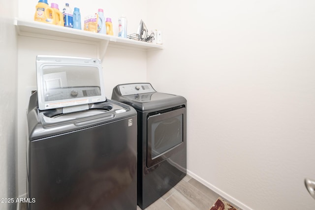 laundry room featuring separate washer and dryer