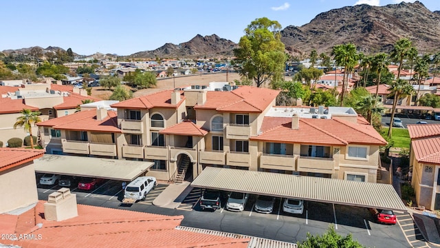 drone / aerial view featuring a residential view and a mountain view