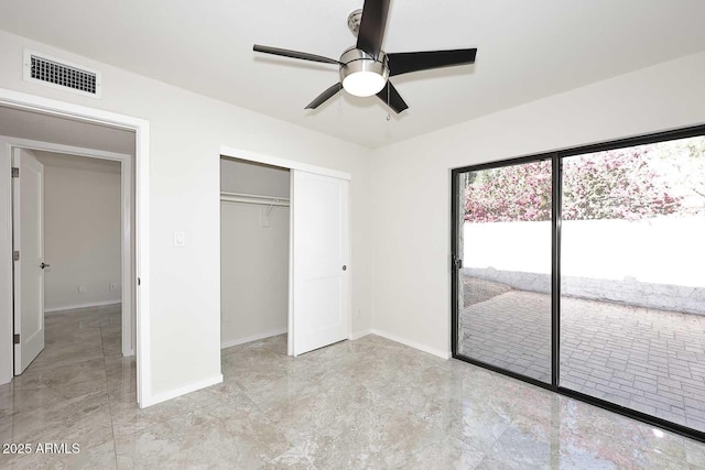 unfurnished bedroom featuring ceiling fan, access to outside, and a closet